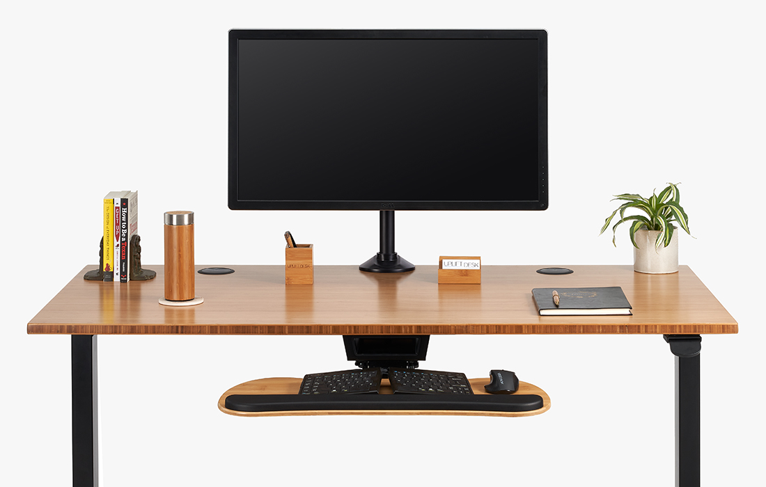 A Bamboo Big Standard Keyboard Tray mounted to a 48 x 30 Bamboo Standing Desk