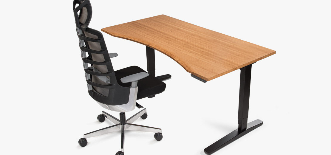 A woman sits on ergonomic sit stand seating